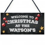 Christmas at the 'Surname' plaque. Personalised Hanging Sign