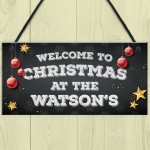 Christmas at the 'Surname' plaque. Personalised Hanging Sign