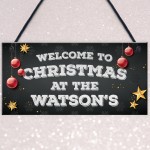 Christmas at the 'Surname' plaque. Personalised Hanging Sign