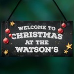 Christmas at the 'Surname' plaque. Personalised Hanging Sign