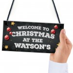 Christmas at the 'Surname' plaque. Personalised Hanging Sign