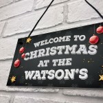 Christmas at the 'Surname' plaque. Personalised Hanging Sign